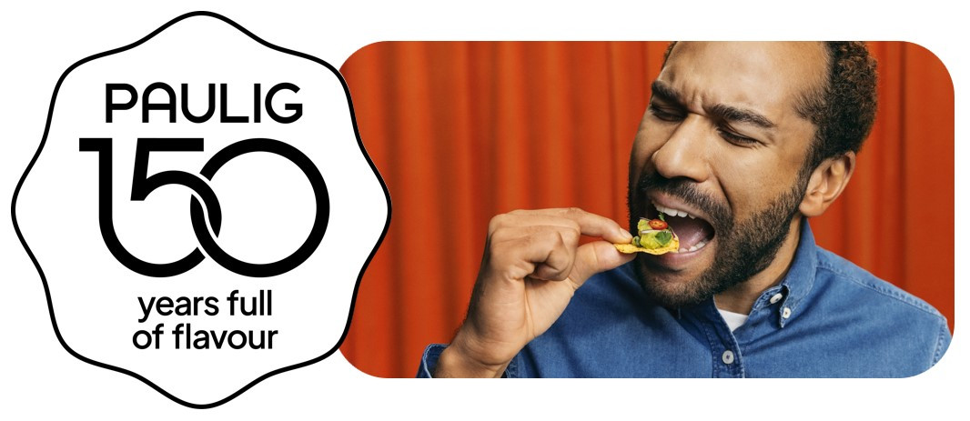 Paulig 150 emblem and man eating snack